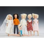 Six 1970s Sindy dolls: five blondes and one brunette, wearing Beautiful Bride, possibly Tangerine