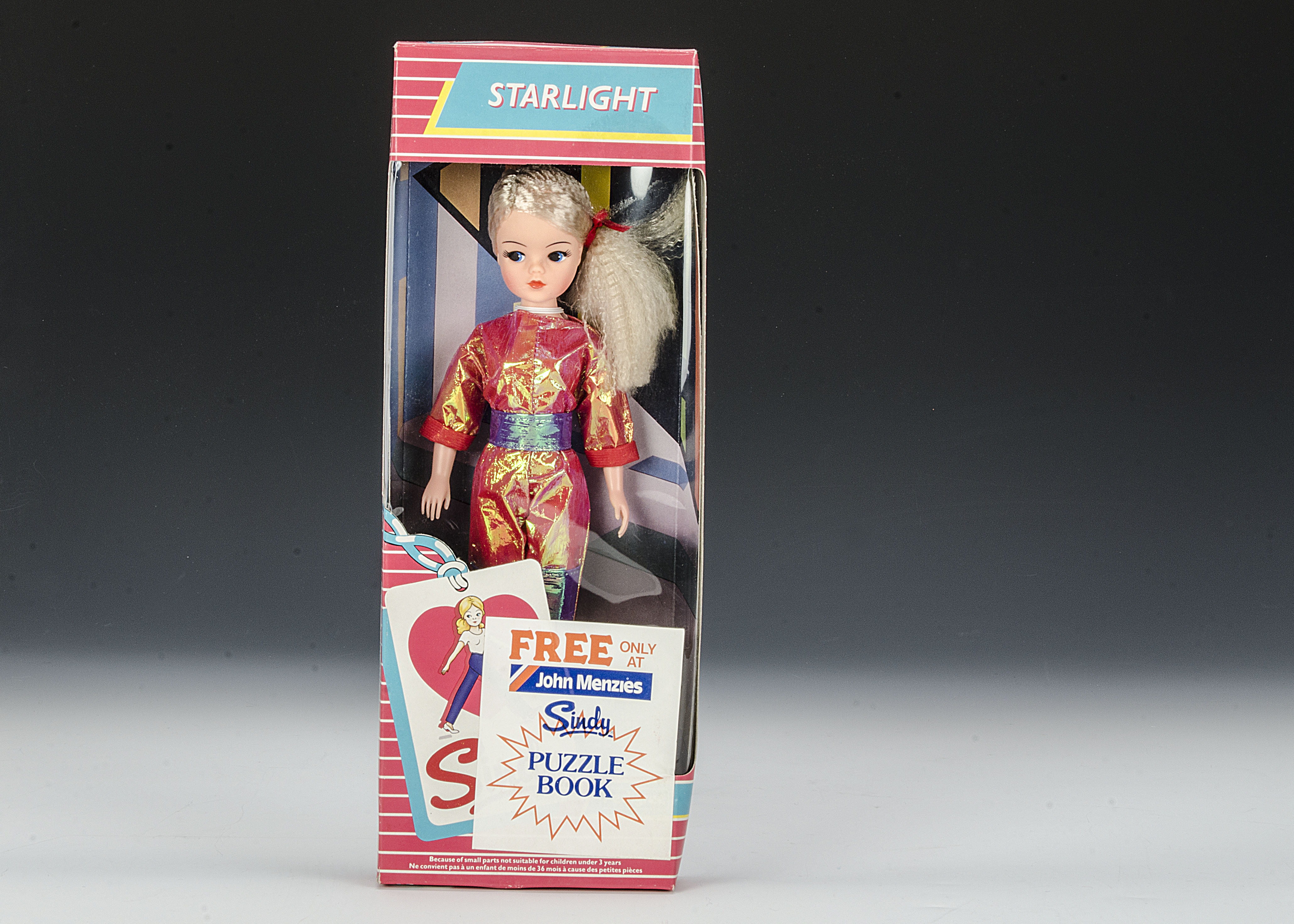 A Pedigree Starlight Sindy, No.42011, 1985, with pink crimped hair, pink and blue metallic jumpsuit,