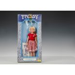 A Palitoy Tressy 1980s, blonde hair and red top with red and white gingham skirt, in original window