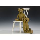 Two German 1930s teddy bears: with golden mohair, orange and black glass eyes, slotted-in ears,