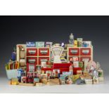 A German toy grocery shop, 1950s, painted cream wood with red drawers and counter, scales and cash