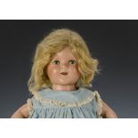 An Ideal Shirley Temple doll, composition with sleeping eyes, blonde mohair wig, original clothes