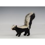 A rare Steiff skunk, 1962-63, with short mohair back, black velvet body and longer mohair tail -