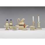 A German turned wood and painted dolls’ house dressing table set, comprising a pair of candlesticks,