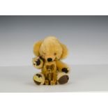 A Merrythought Cheeky teddy bear, 1960s, with golden mohair, orange and black plastic eyes, velvet