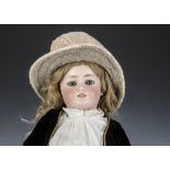 A Simon & Halbig 1078 child doll, with blue sleeping eyes, oily finish, pierced ears, original brown