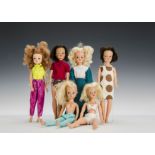 Six 1970s Sindy dolls: three blondes, two brunettes and curly titian, wearing a large brown