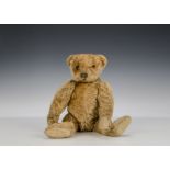 A rare early Steiff cone nosed Teddy Bear with small blank button, with apricot mohair, black boot