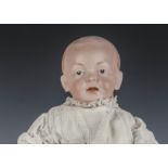 An Eisenmann & Co Einco character baby, similar to the Kaiser baby with blue intaglio eyes, open/