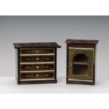 Two pieces of Waltershausen dolls’ house furniture: a chest of drawers with gilt transfer decoration