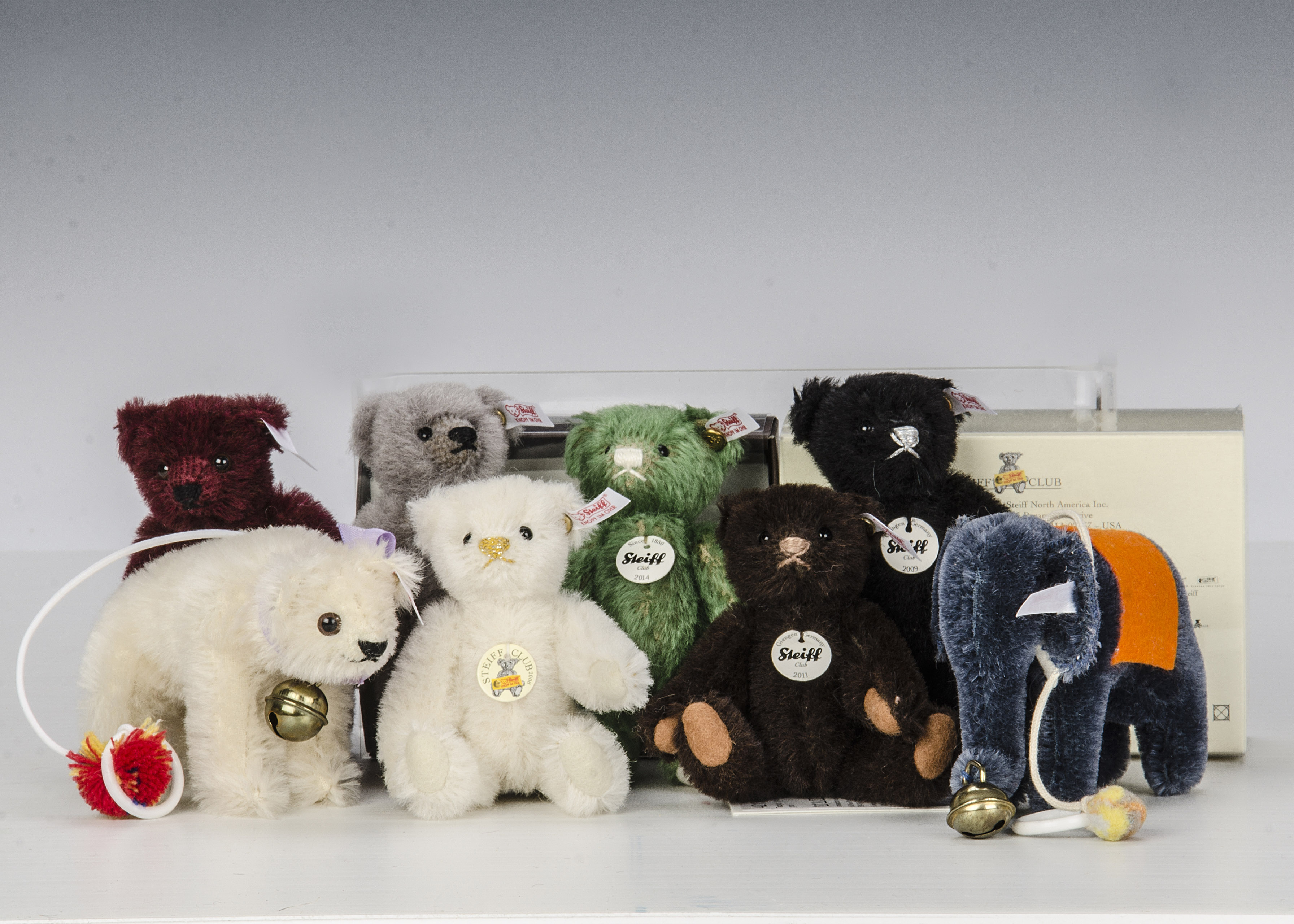 Eight Steiff Club Gift miniature Teddy Bears: 2006, 2007 elephant, 2008 to 2012 and 2014, in
