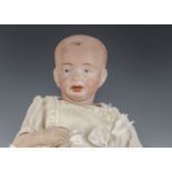 A German character baby mould 610, with blue painted eyes, open/closed mouth, blonde painted hair,