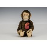 A Schuco Tricky yes/no monkey 1950s, with brown mohair, felt face, ears and hands, tail-operated