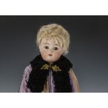 A Simon & Halbig for Kämmer & Reinhardt shoulder head doll, with head turned slightly to the