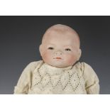 An Armand Marseille 1923 Bylo Baby, with blue sleeping eyes, closed moth, moulded and painted blonde