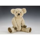 A French teddy bear 1940, with light golden mohair, clear and black glass eyes, pronounced clipped