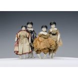 Four bisque shoulder-head dolls’ house dolls, with painted black hair, cloth bodies and bisque lower