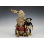 Three Dean’s Rag Book Co. soft toys: an early printed circus monkey in tailcoat, swivel head and