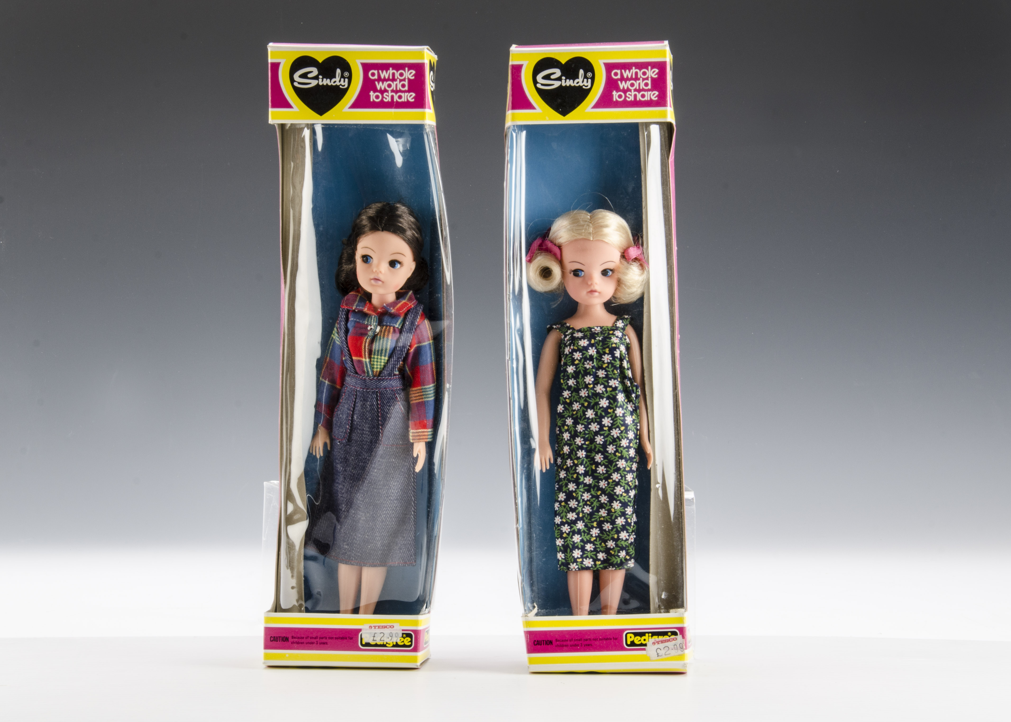 Two Pedigree Sindy dolls No.44899: one brunette in Lumberjack short and denim braces skirt and a