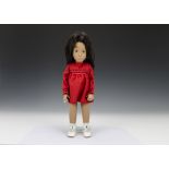 A Trendon Sasha doll Brunette Red Dress, 104, with long brown hair, red smocked dress, white socks