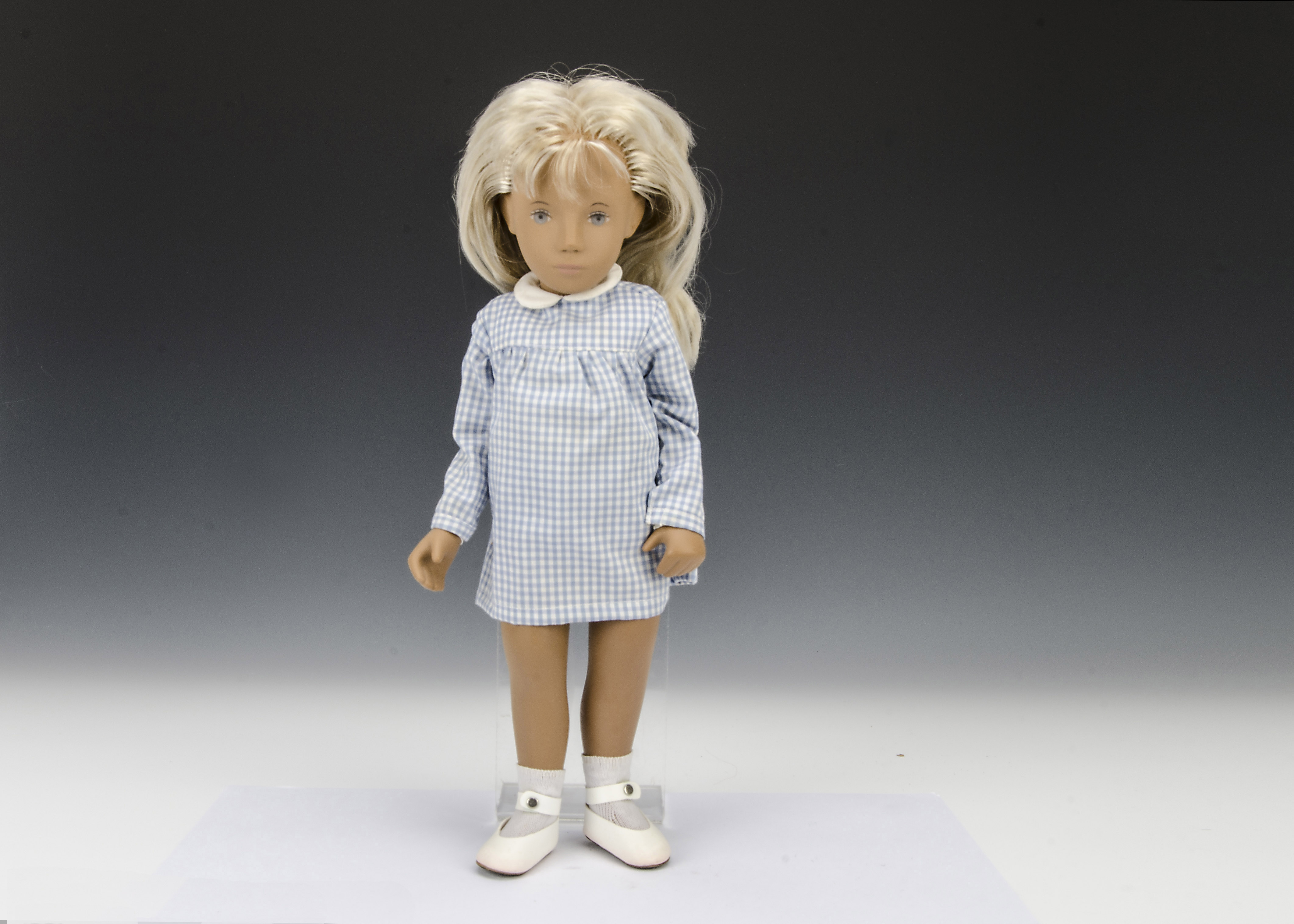 A Trendon Sasha doll Blonde Gingham, 107, with long two-tone blonde hair, blue gingham dress,
