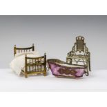 Small scale dolls’ house furniture: an early cardboard bath sweet container with foiled and