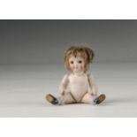 A J.D. Kestner 189 all-bisque googlie doll, with brown sleeping googlie eyes, small closed smiling