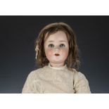 A Schoenau & Hoffmeister 914 child doll, with blue lashed sleeping eyes, brown mohair wig, jointed