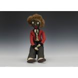 An early homemade elongated Golliwog, with button eyes, fur hair, red tailcoat, kid waistcoat and