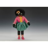 A Dean’ Rag Book Co. girl Golliwog, of felt with plastic googlie eyes, black nylon hair, pink,