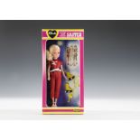 A Pedigree Sindy Skater No.44710, 1982, with blonde hair and red sparkly outfit, in original pink