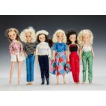 Six Sindy dolls 1970 and 80s: three blonde, two brunettes and one auburn, wearing Jumping Jive,