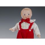 An Armand Marseille 258? googlie boy doll, with blue intaglio side-glancing eyes, closed smiling