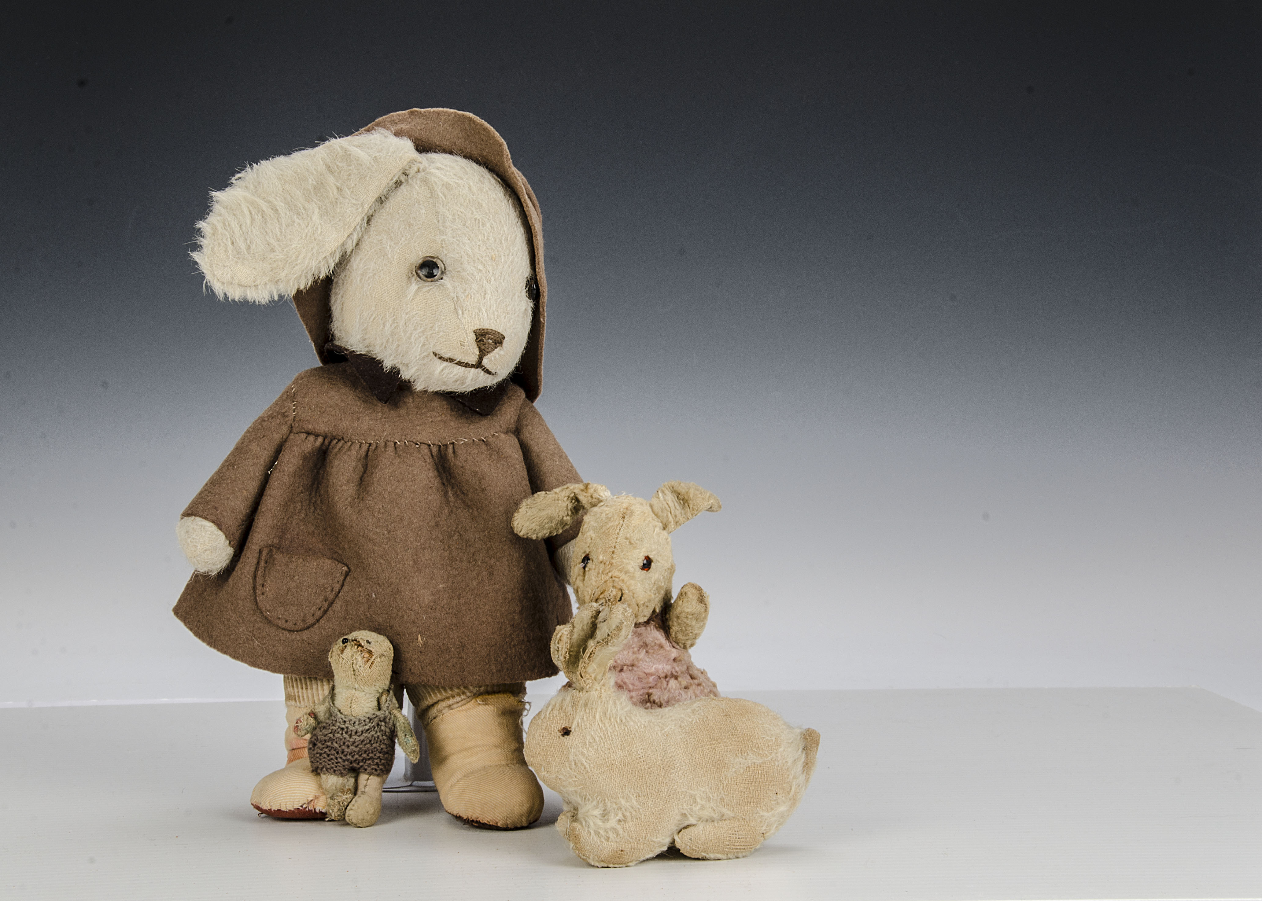 A Farnell ‘soldier’ mascot teddy bear, circa WWI, with blonde mohair, one bead eyes, swivel head,