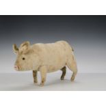 A rare Steiff Squeak Pig, 1910-20s, with pink mohair, black boot button eyes, forward facing ears,