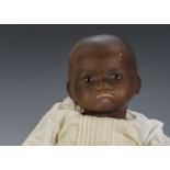 An Armand Marseille 341 black baby, with brown sleeping eyes, closed mouth and bent limbed body -