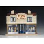 A Lines Brothers Ltd Tri-ang Stores dolls’ house, with double curved shop front, revolving central