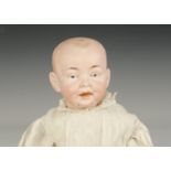 A German bisque headed character baby, similar to the Kaiser baby with blue intaglio eyes, open/