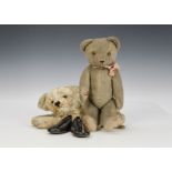 A German teddy bear, 1930s, with blonde wool plush, orange and black glass eyes, pronounced