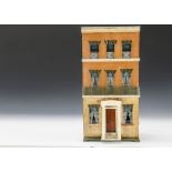 A paper-covered box back dolls’ house, with three storeys, printed paper façade, the ground floor of