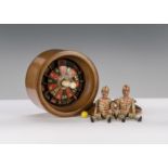 Two late 19th century German carved wooden sportsmen, with painted red and white striped cap and