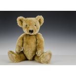 A Chiltern 1930s teddy bear, with golden mohair, clear and black glass eyes with remains of brown