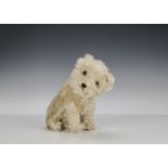 An unusual 1930s Steiff white mohair Molly dog, with large brown and black glass eyes, black