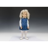 A Trendon Sasha doll Blonde Tunic, 115s, with blue dress, white blouse printed with blue flowers,