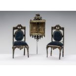 Soft metal dolls’ house furniture: a pair of chairs with grape vine decoration, bronze wash and blue