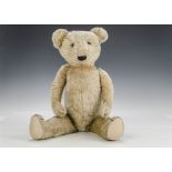 An early German teddy bear 1910-20s, with golden mohair, black boot button eyes, pronounced