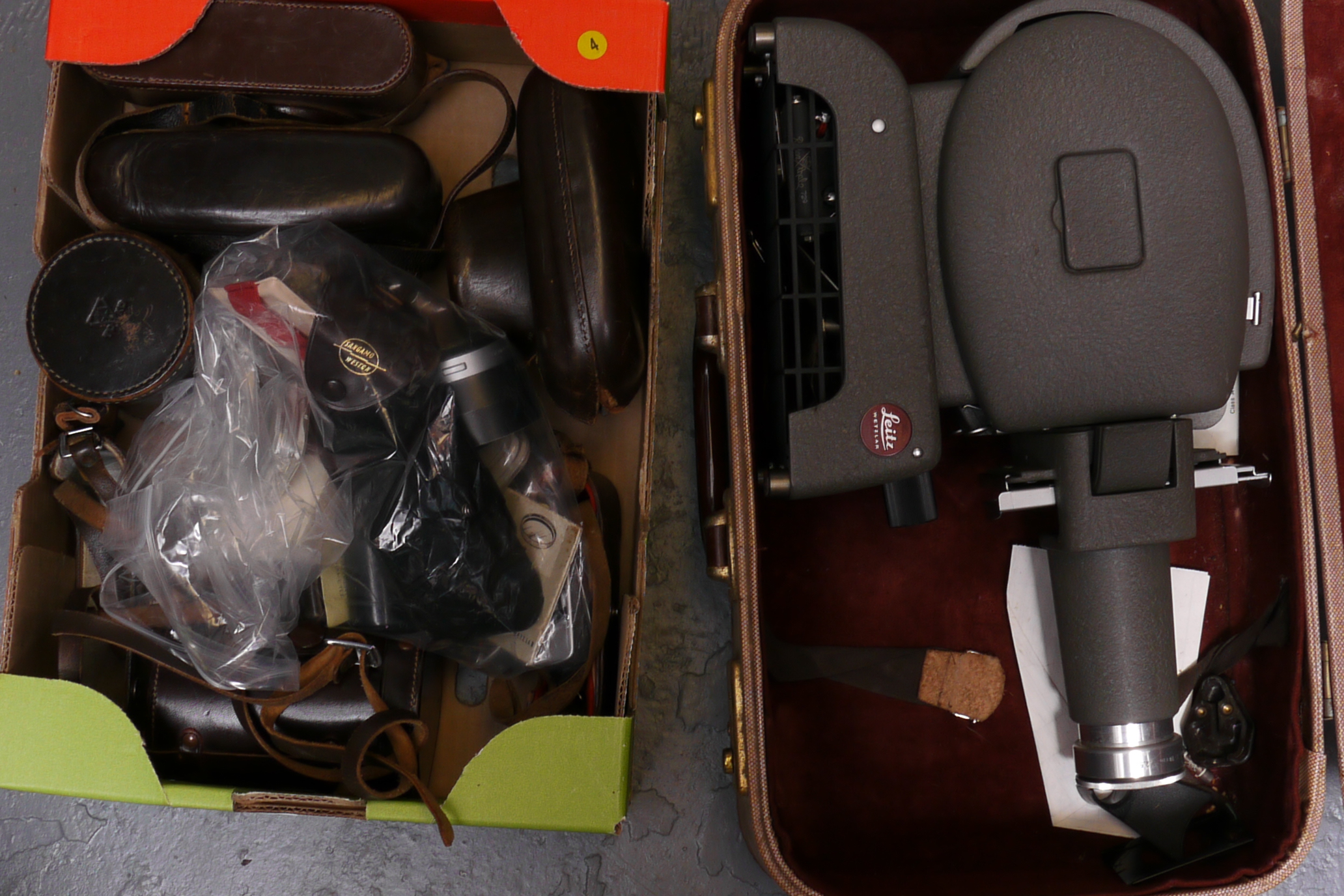 Leica Items: a Prado Projector in Makers case with camera cases, meters and other items (2 boxes)