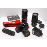 Canon A1 Outfit: body with winder and 3 lenses and other items (a lot)