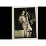 Led Zeppelin / John Paul Jones, four photographs stage shots, believed to be contemporary silver