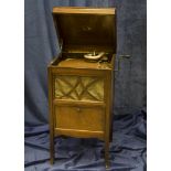 Cabinet gramophone: an HMV Model 145A with 5a soundbox, in oak case (grille cloth replaced, polish